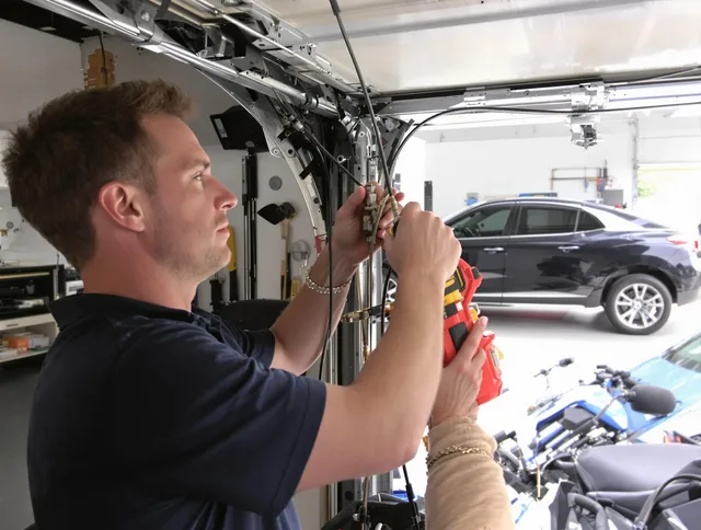Pompano Beach Garage Door Repair safety certified technician performing cable replacement in Pompano Beach