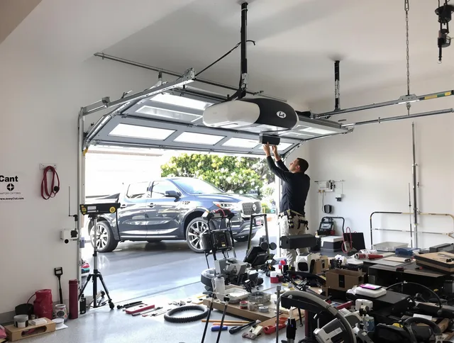 Pompano Beach Garage Door Repair specialist installing smart garage door opener system in Pompano Beach home